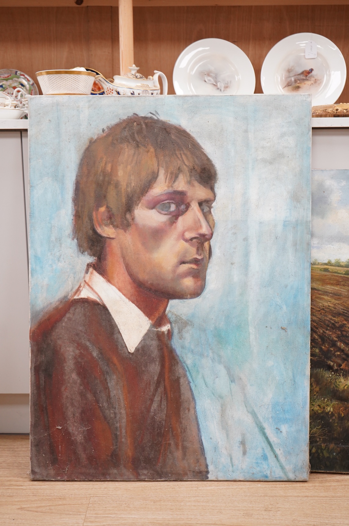 Chris Deakin (1946-2007), Rural landscape and Portrait of a young gentleman, one signed, two Modern British oils on canvas, unframed, largest 77 x 111cm